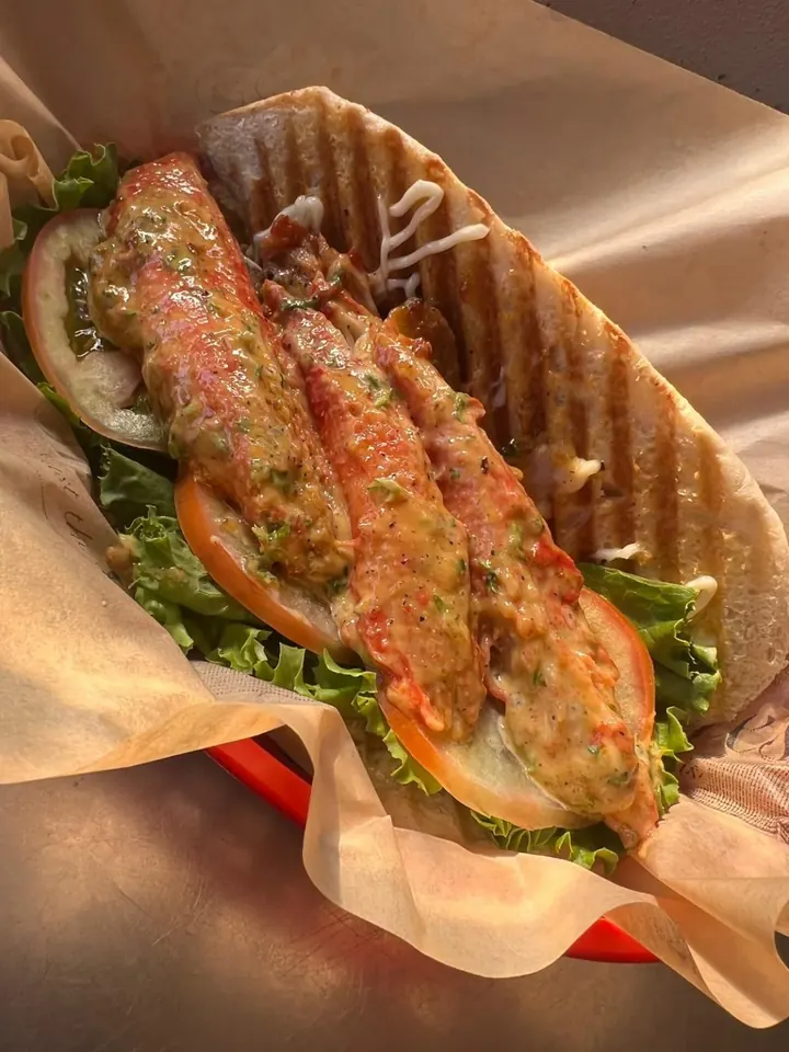 Crab meat panini with lettuce, tomato and mayo